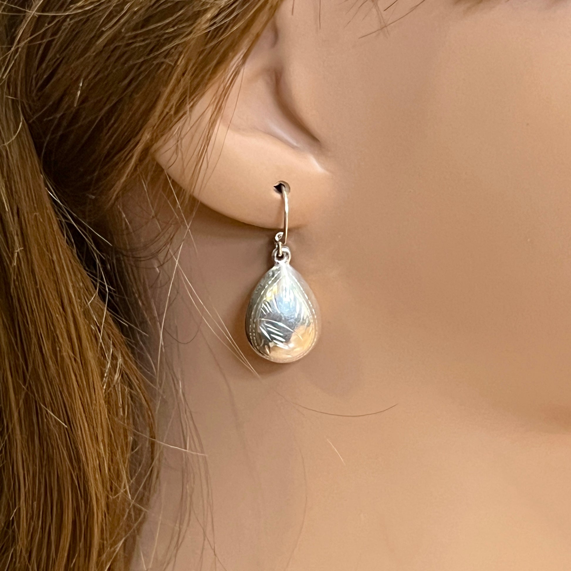 Sterling silver puff teardrop earrings with etched leaf design