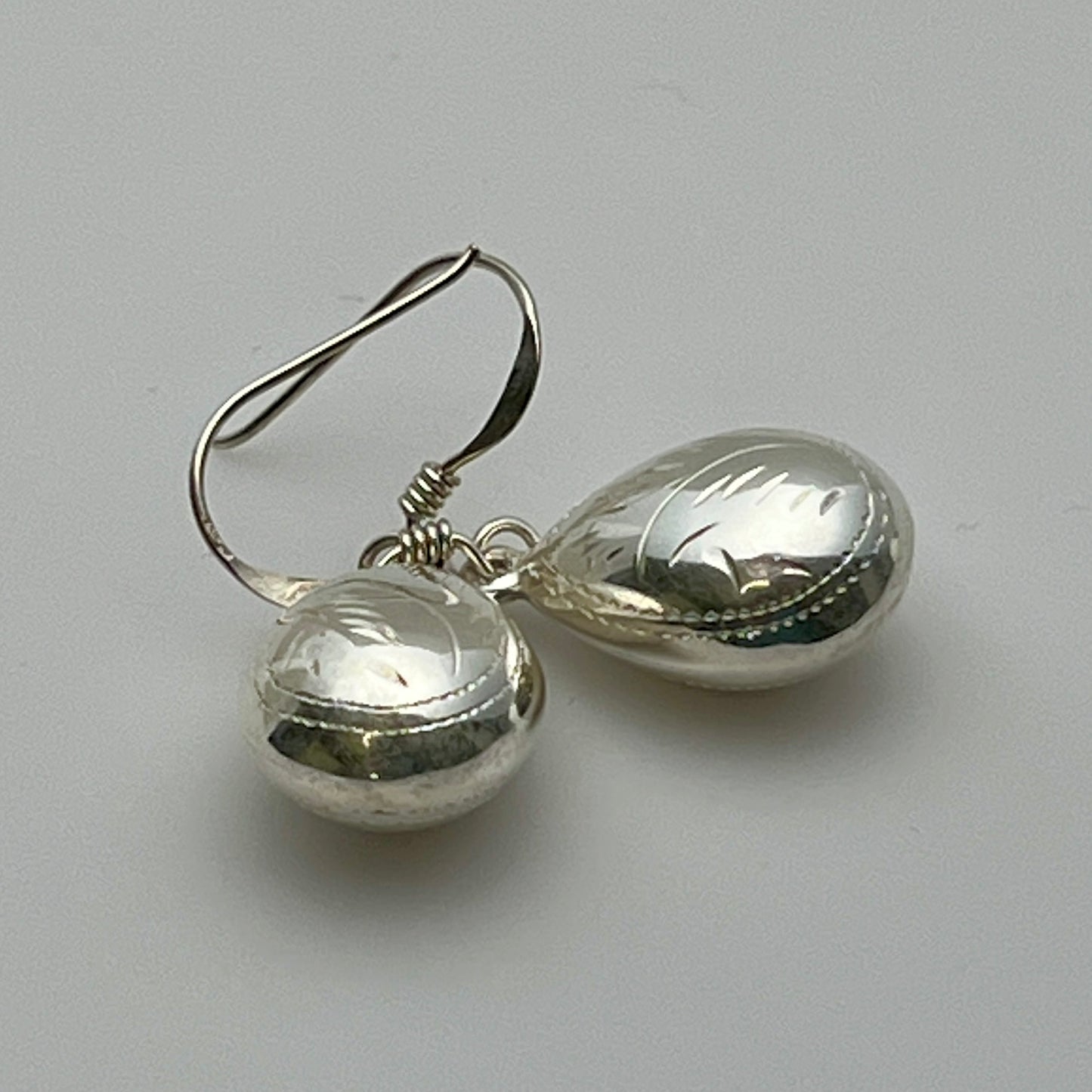 Lightweight teardrop sterling earrings with engraved detail