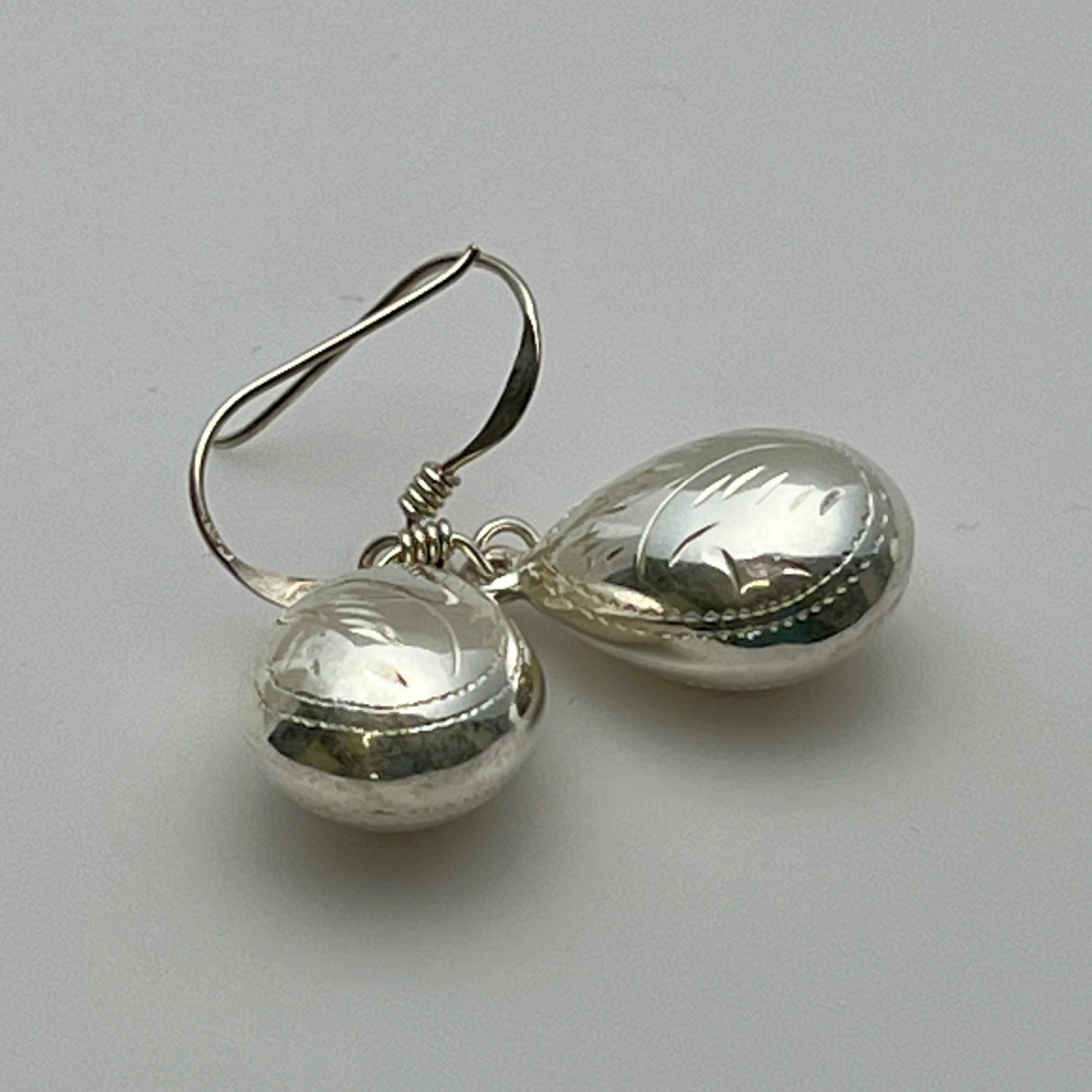 Lightweight teardrop sterling earrings with engraved detail