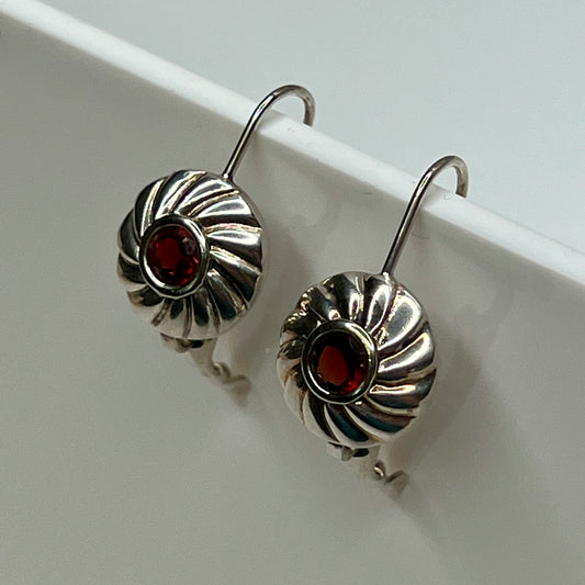Sterling silver leverback earrings with red spinel cabochons in swirl design