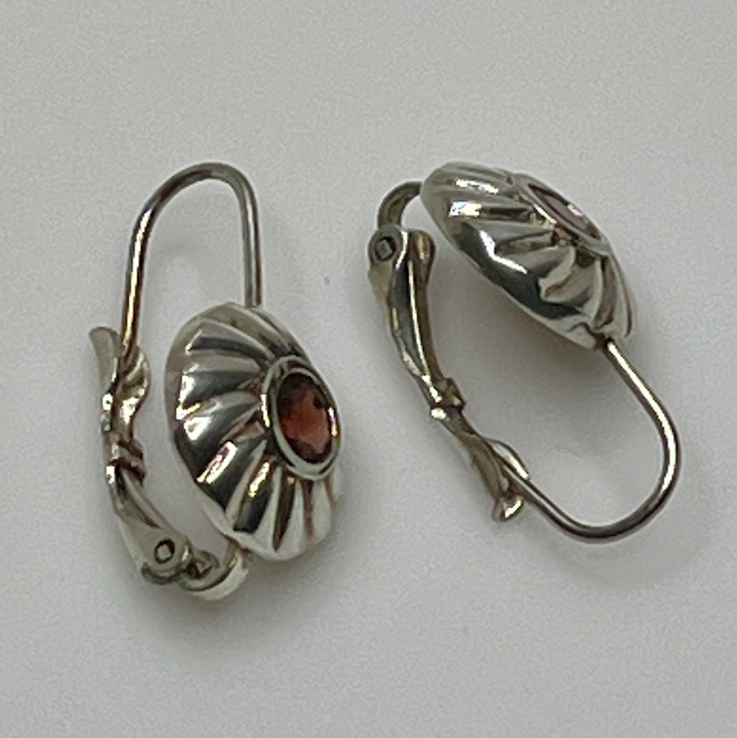 Sterling silver leverback earrings with red spinel cabochons in swirl design