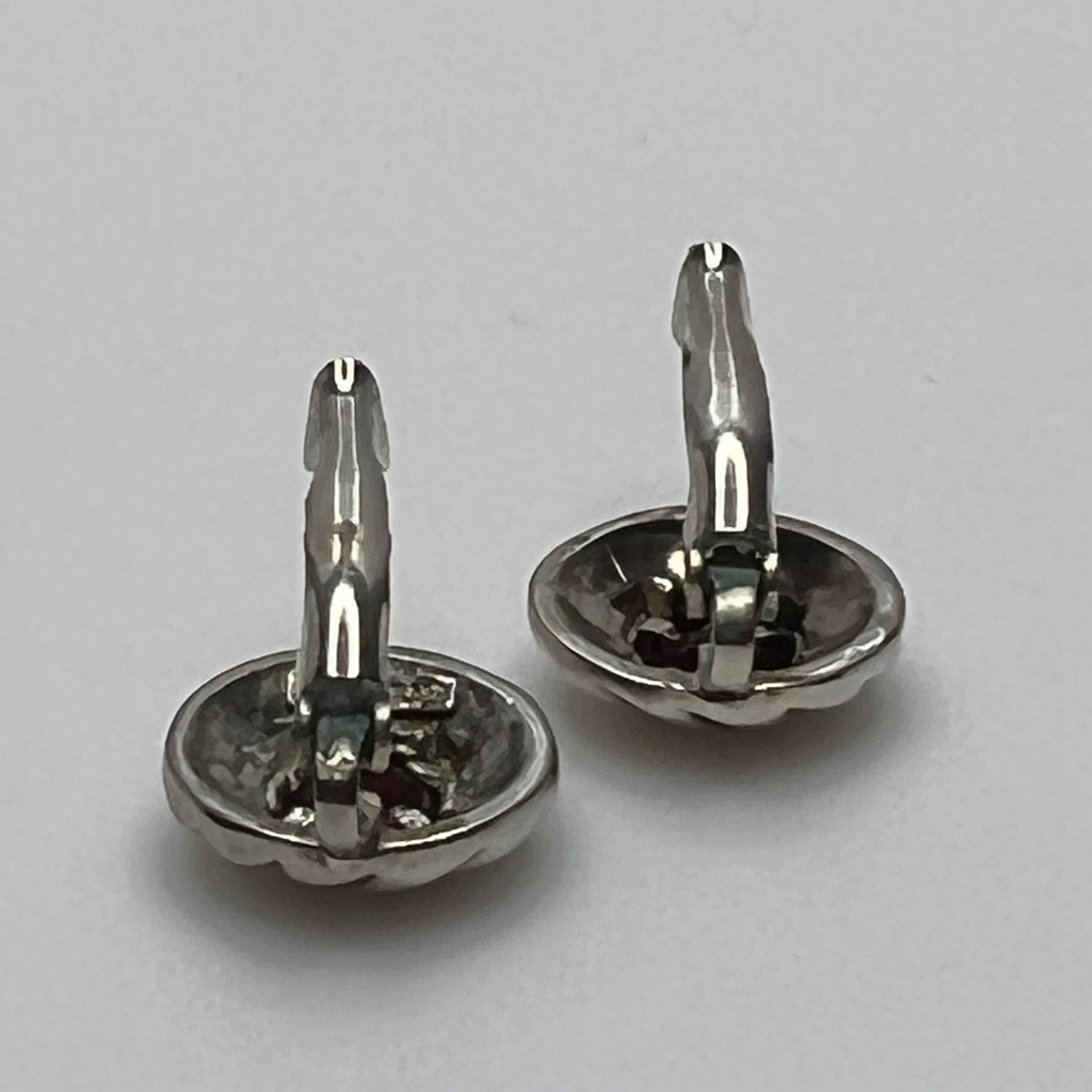 Sterling silver leverback earrings with red spinel cabochons in swirl design