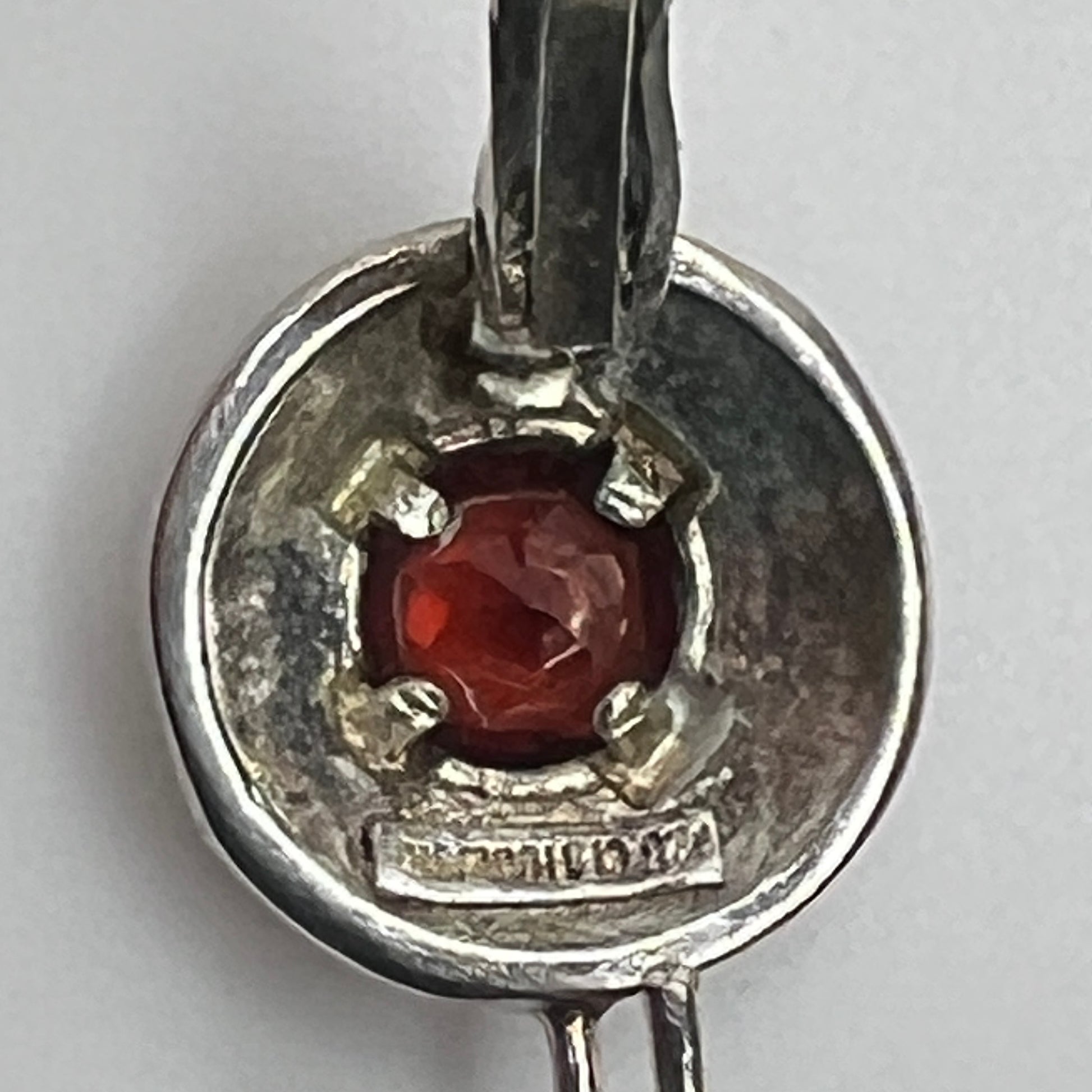 Sterling silver leverback earrings with red spinel cabochons in swirl design