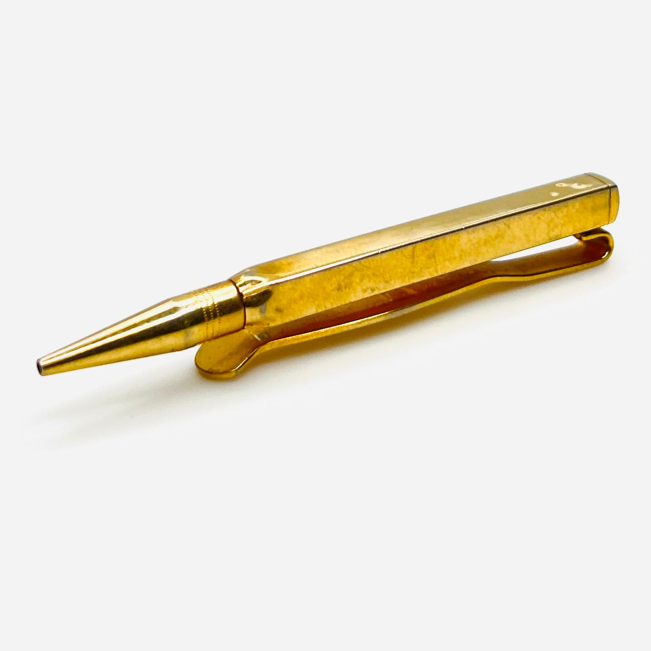 Side view of vintage Swank retractable pencil tie clip showing pencil mechanism