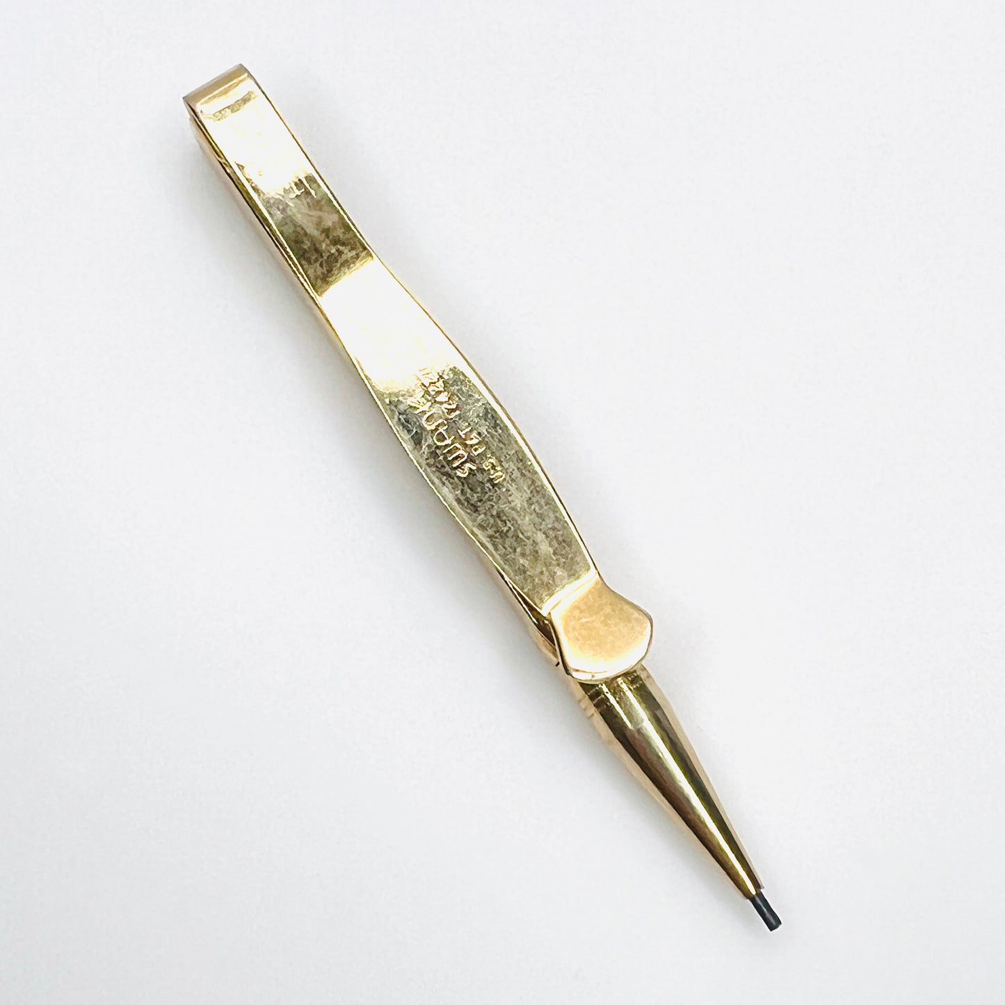 Swank signature and U.S. patent marking on vintage gold tone pencil tie clip