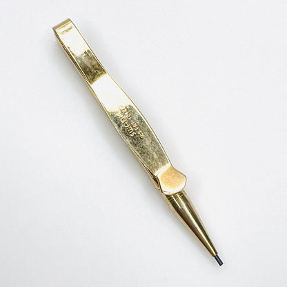 Swank signature and U.S. patent marking on vintage gold tone pencil tie clip