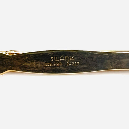 Close up of Swank signature and U.S. patent marking on vintage gold tone pencil tie clip