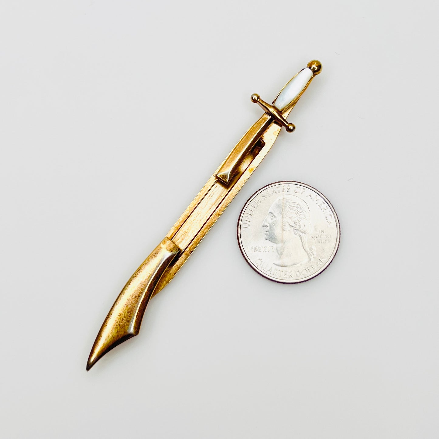 Vintage Swank saber tie bar with mother of pearl handle