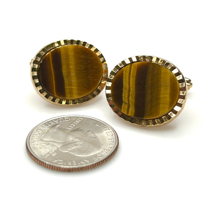 Genuine tiger eye oval cufflinks from West Germany shown beside a coin for scale