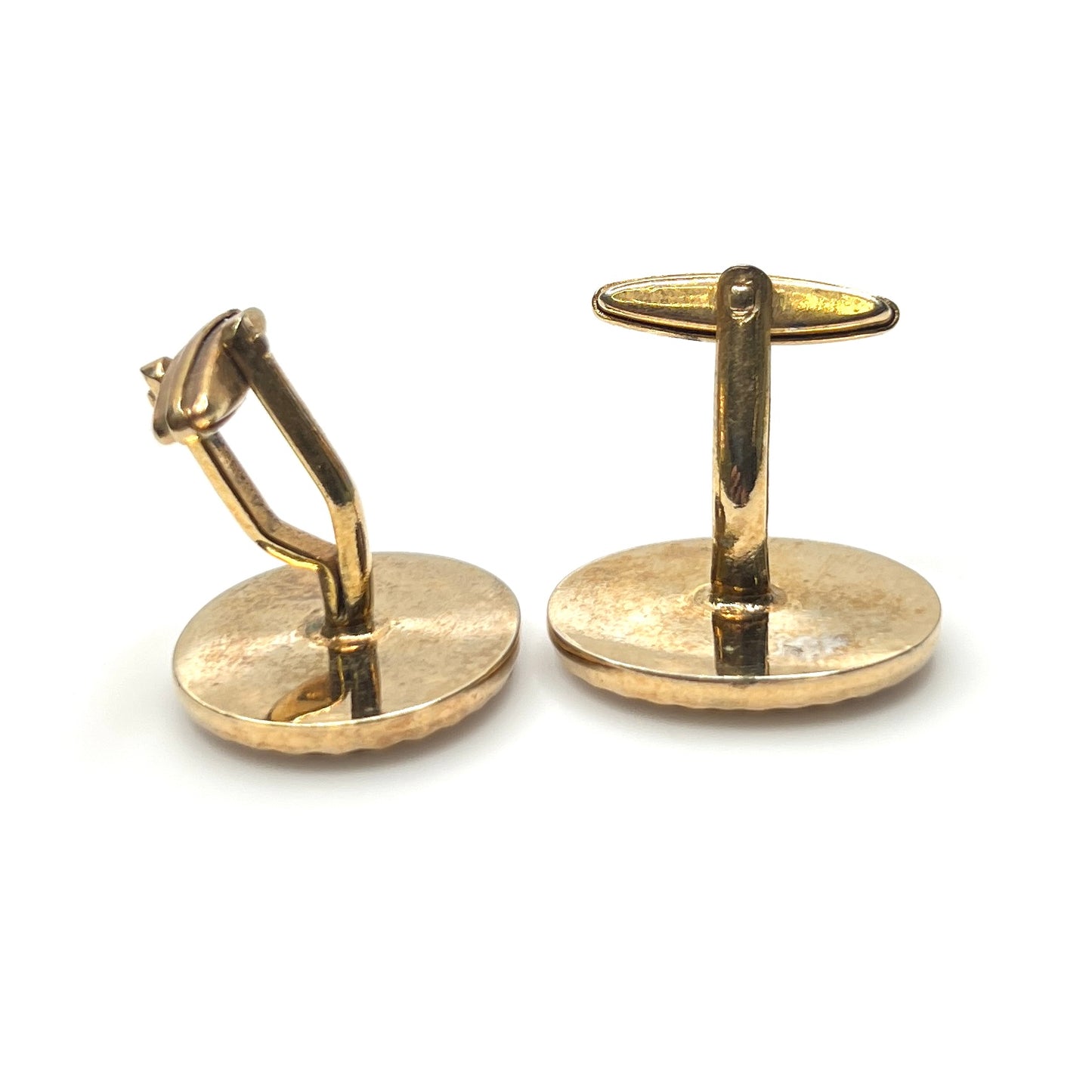 Side view of vintage tiger eye cufflinks with gold tone toggle backs