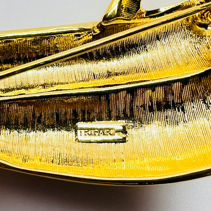 Signed Trifari TM mark on reverse of vintage gold tone brooch