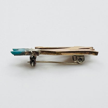 Side profile of vintage mixed metal cat brooch