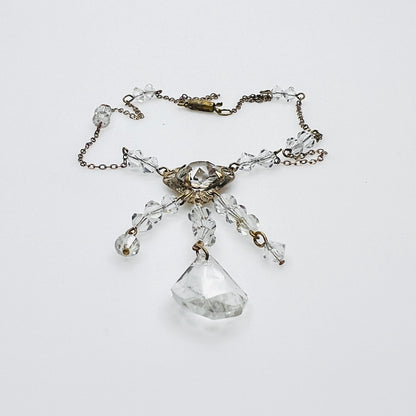 Side view of vintage crystal tassel necklace showing articulated pendant construction