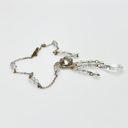 Side view of vintage crystal tassel necklace showing articulated pendant construction