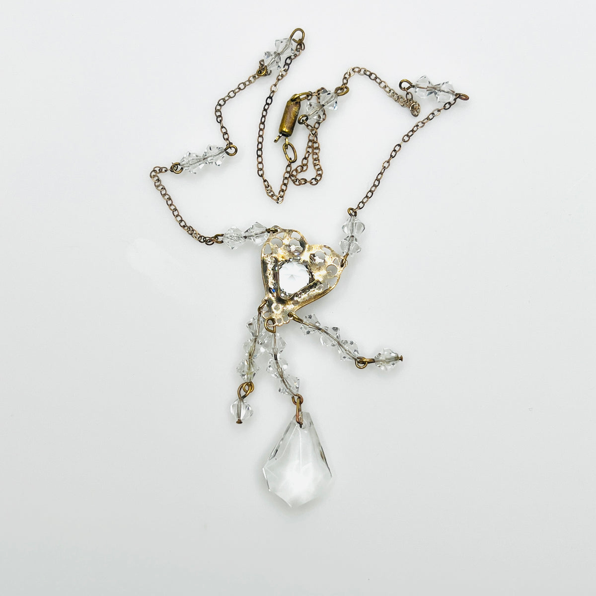 Back view of vintage crystal tassel necklace showing articulated pendant construction