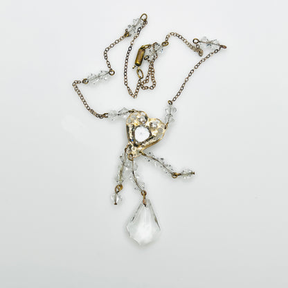 Back view of vintage crystal tassel necklace showing articulated pendant construction