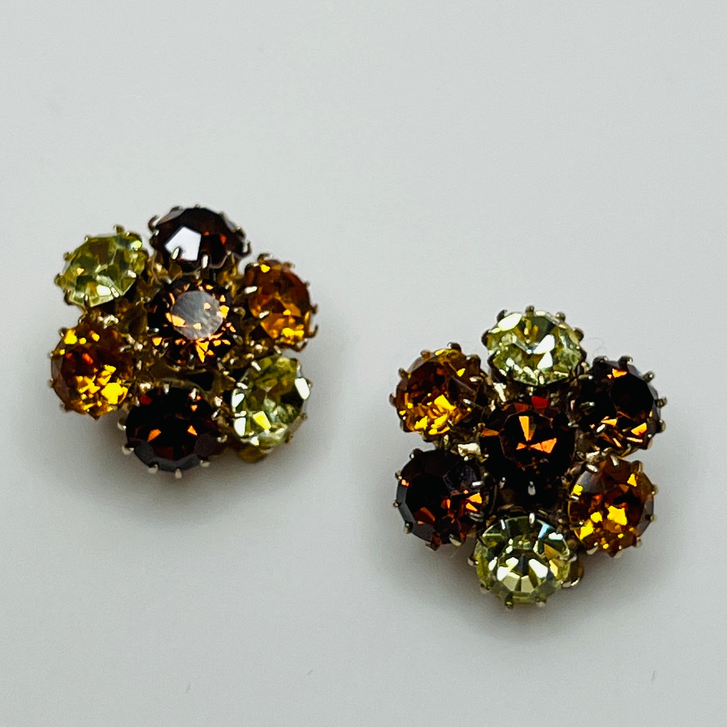 Cluster clip-on earrings with prong-set amber, citrine, and pale yellow stones