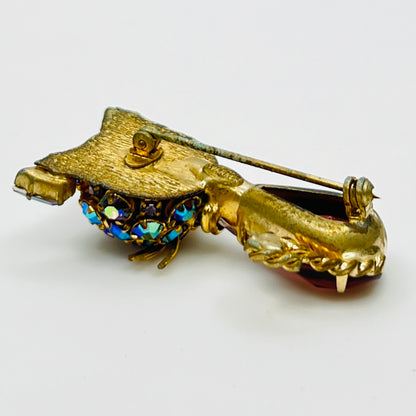 Reverse of Warner brooch with textured gold tone metal and clasp
