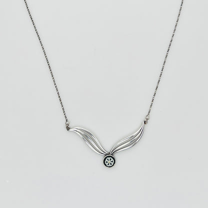 Flat lay of silver Wedgwood pendant necklace with chain
