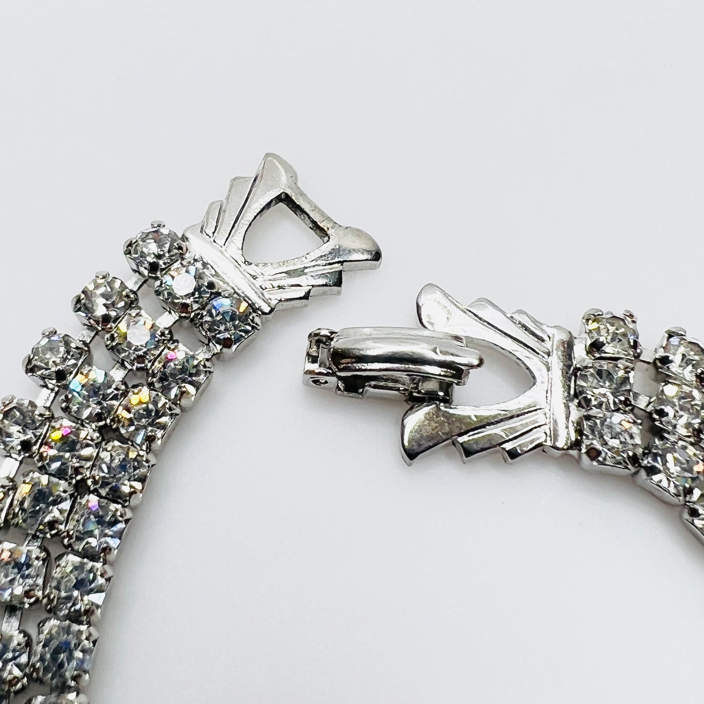 Signed Weiss clasp detail on vintage rhinestone bracelet in silver tone metal