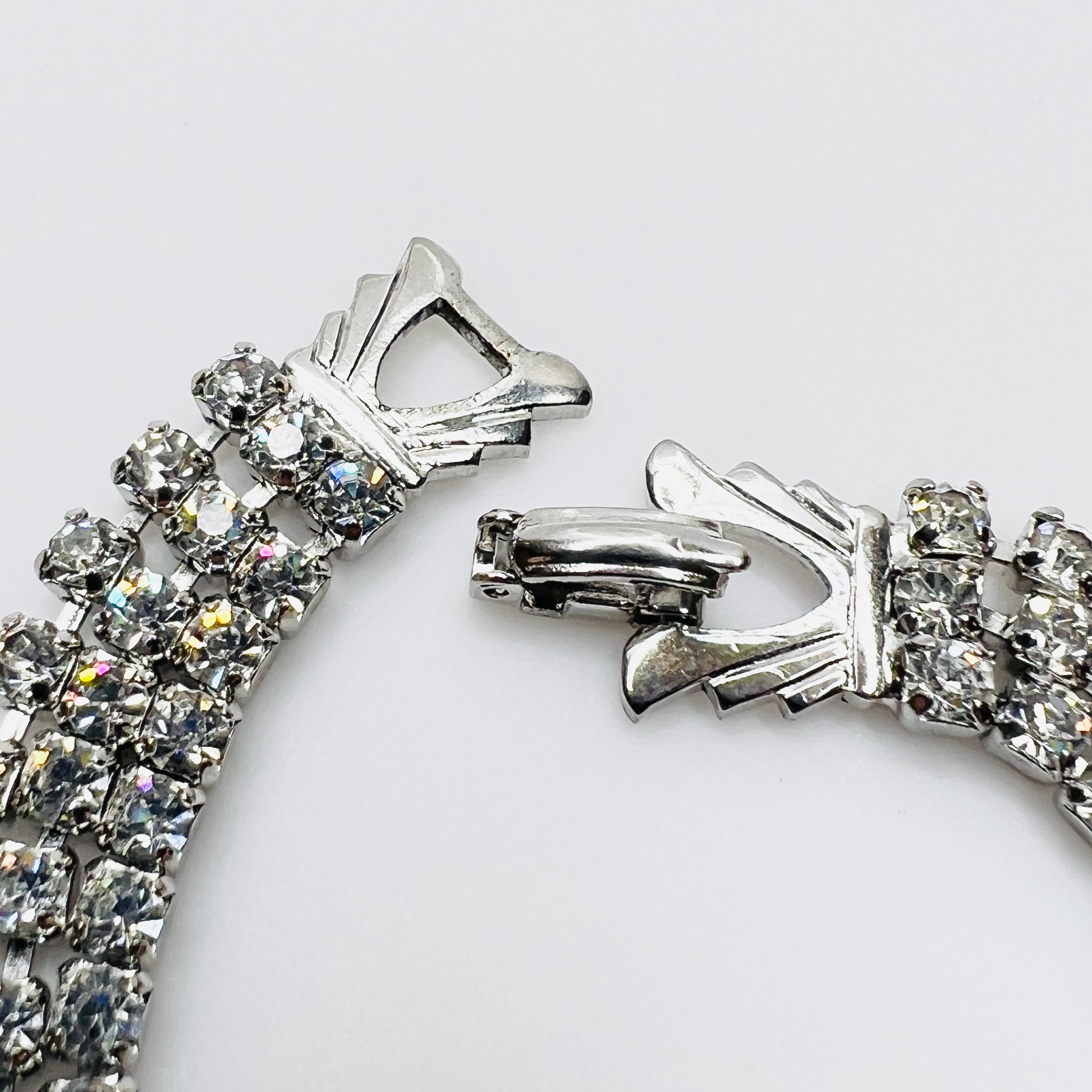 Signed Weiss clasp detail on vintage rhinestone bracelet in silver tone metal