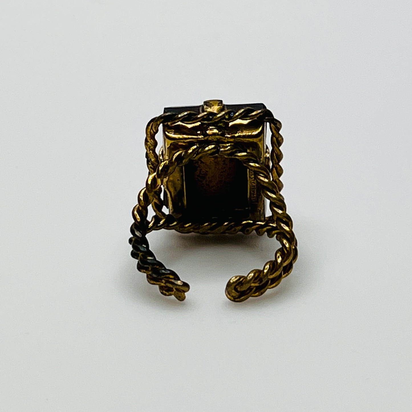 Close-up of rectangular amber stone in vintage setting