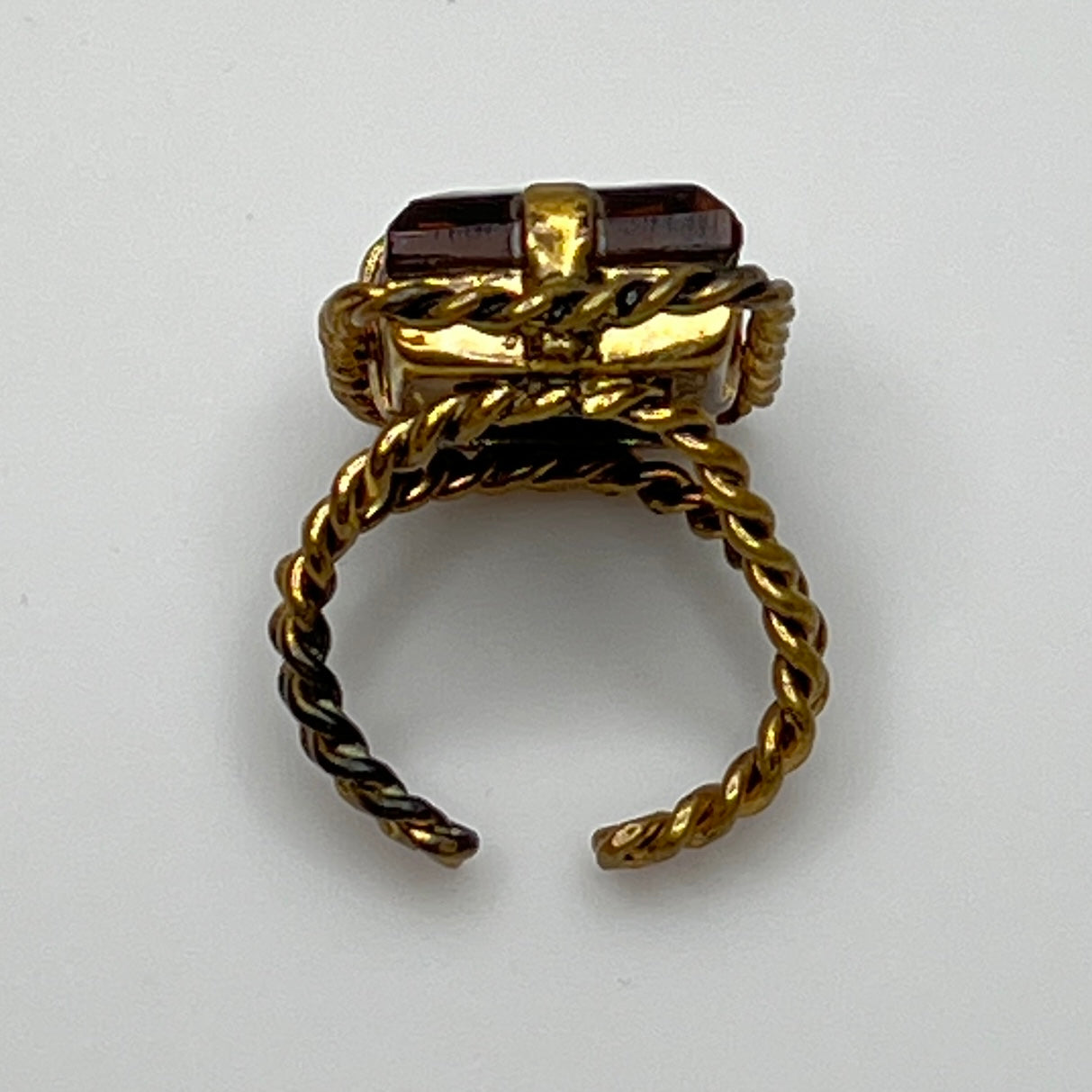 Close-up of rectangular amber stone in vintage setting