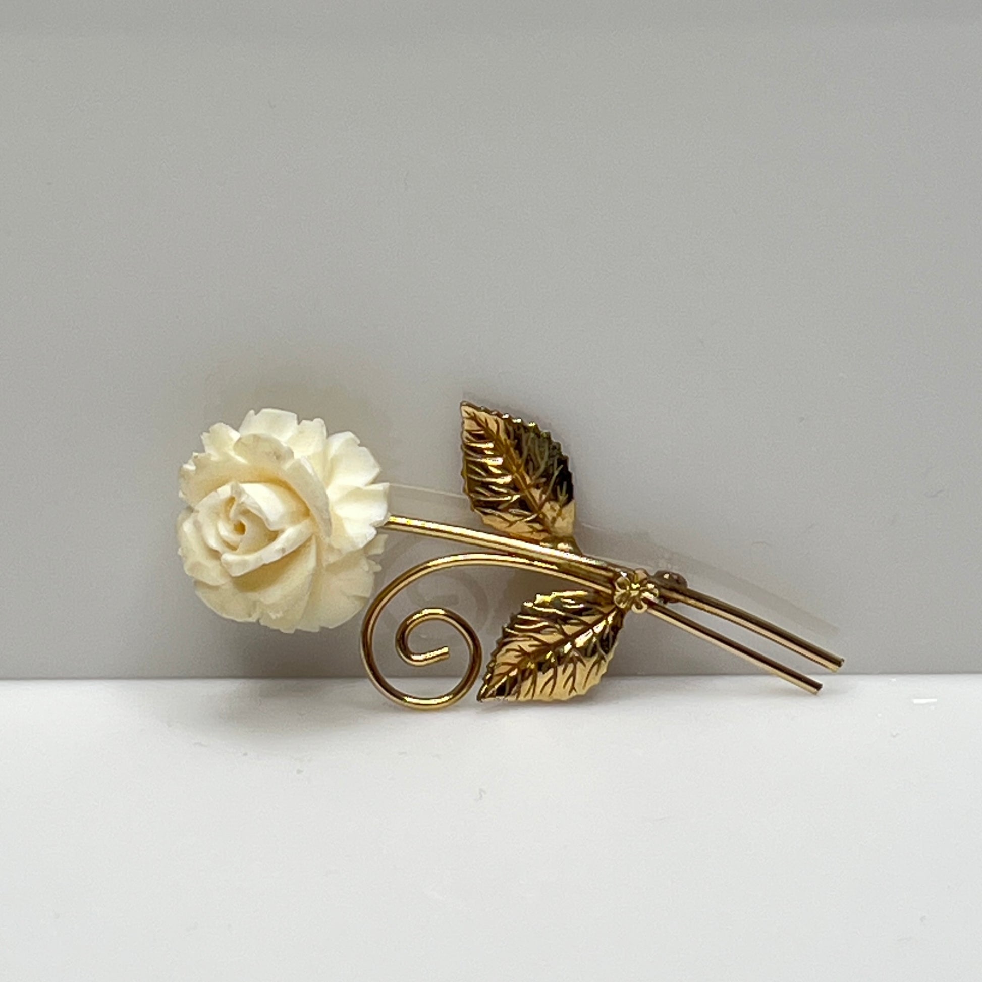 Vintage Winard 12K gold-filled brooch with carved ivory rose and long stem design