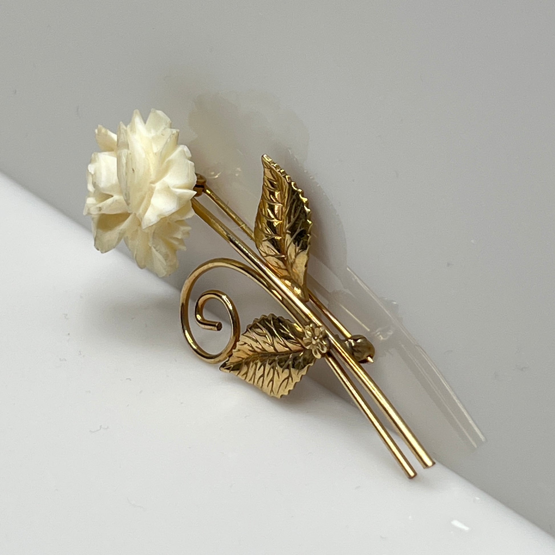 Vintage Winard 12K gold-filled brooch with carved ivory rose and long stem design