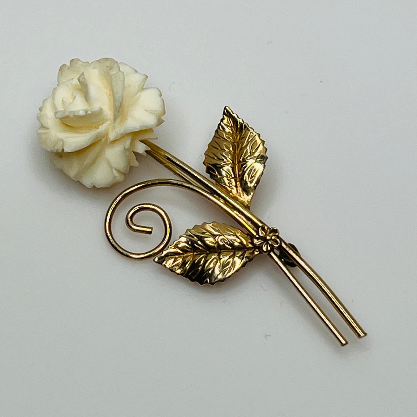 Vintage Winard 12K gold-filled brooch with carved ivory rose and long stem design