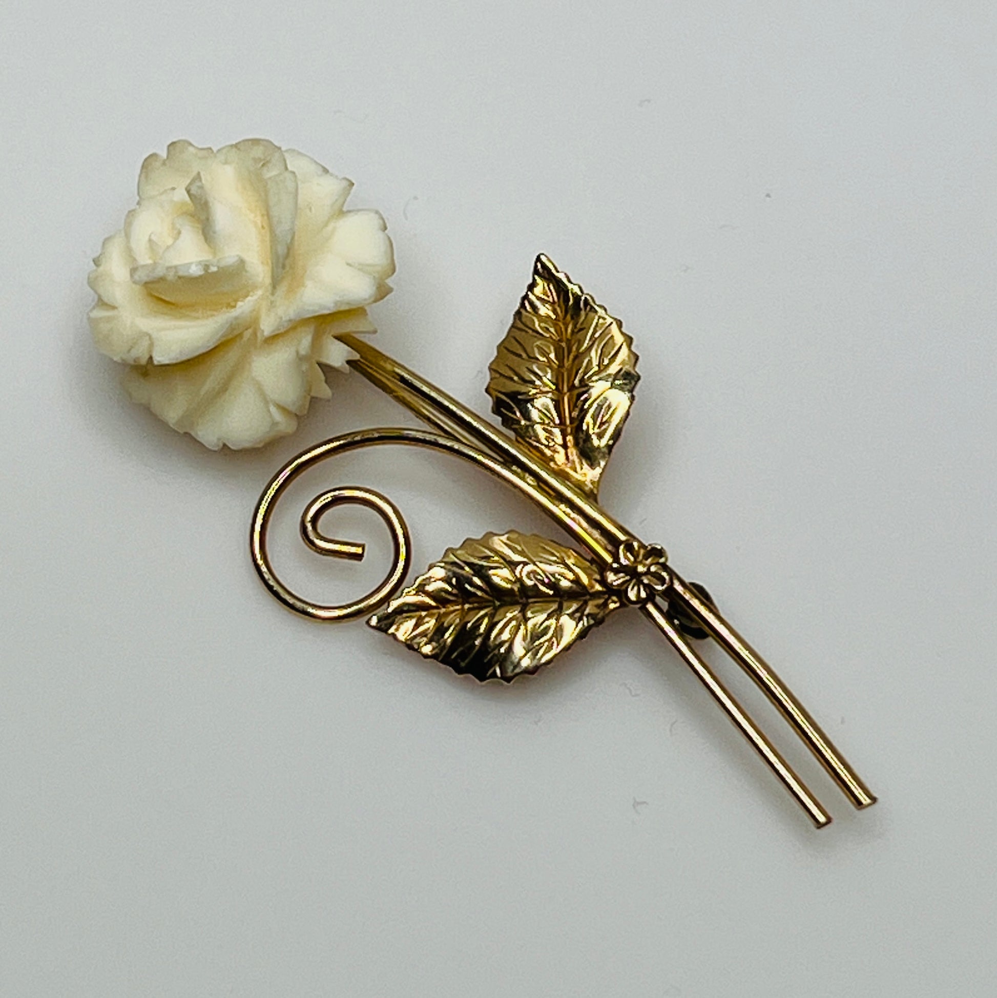 Vintage Winard 12K gold-filled brooch with carved ivory rose and long stem design