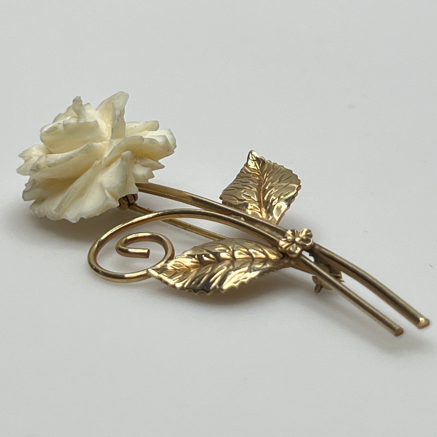 Vintage Winard 12K gold-filled brooch with carved ivory rose and long stem design