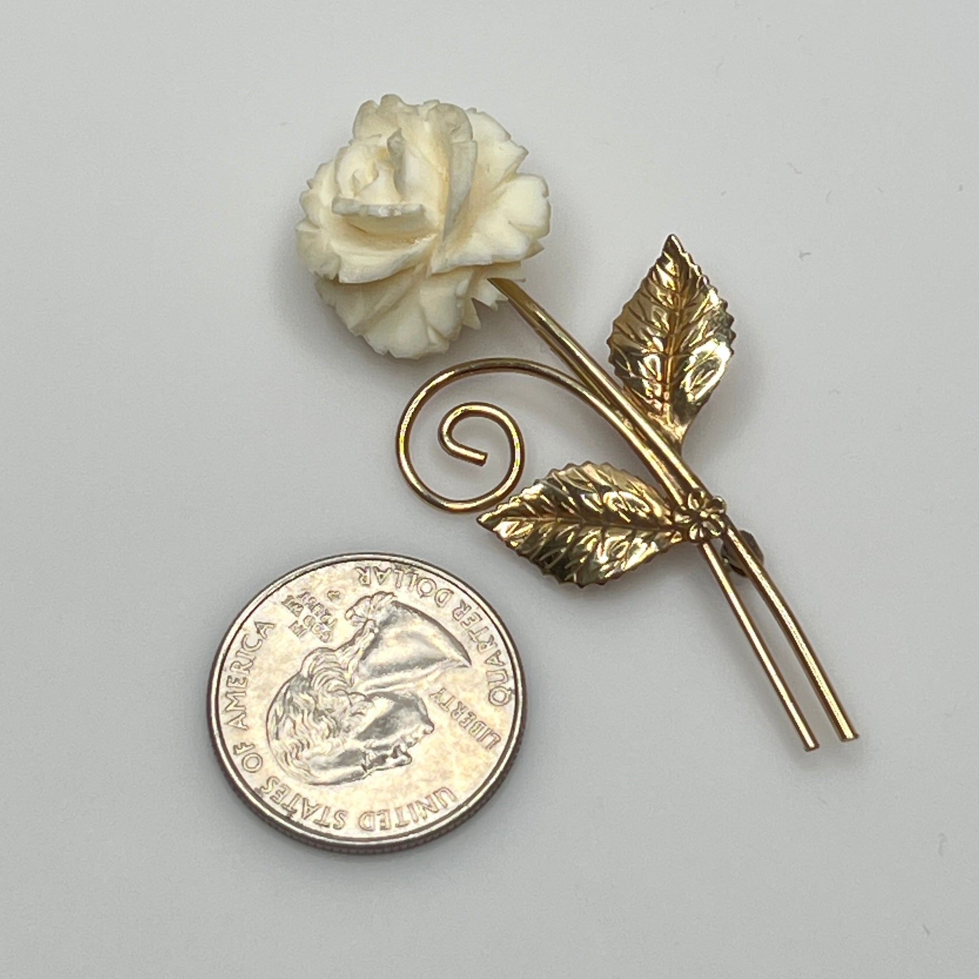 Vintage Winard 12K gold-filled brooch with carved ivory rose and long stem design