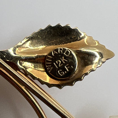 Vintage Winard 12K gold-filled brooch with carved ivory rose and long stem design